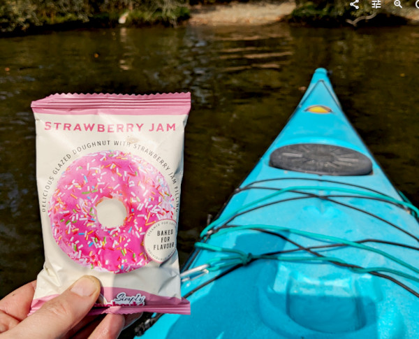 Enjoying a ring bake while kayaking on Windermere.